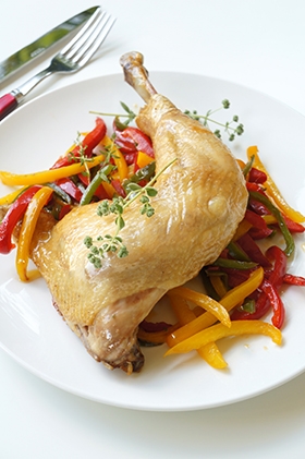 Whole chicken thigh with wine and peppers